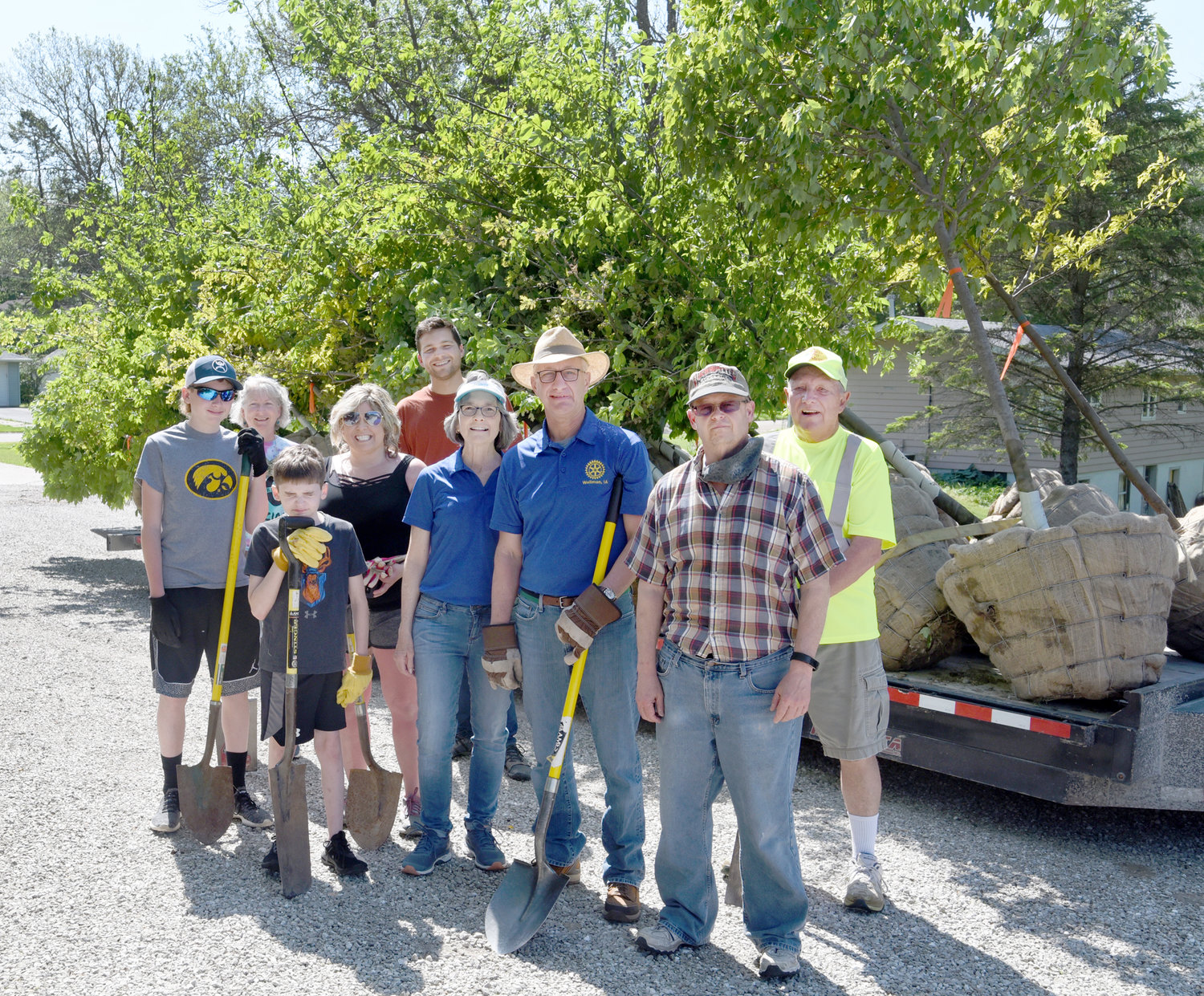 The May 26 tree-planting crew included, from left, Kelyn Yoder, Marianne Reha-Van Roekel, Jason Yoder, Jessica Hochstedler Yoder, Jonah Van Roekel, Merridy and Allen Leichty, Tom Buckwalter and Leroy Powell.